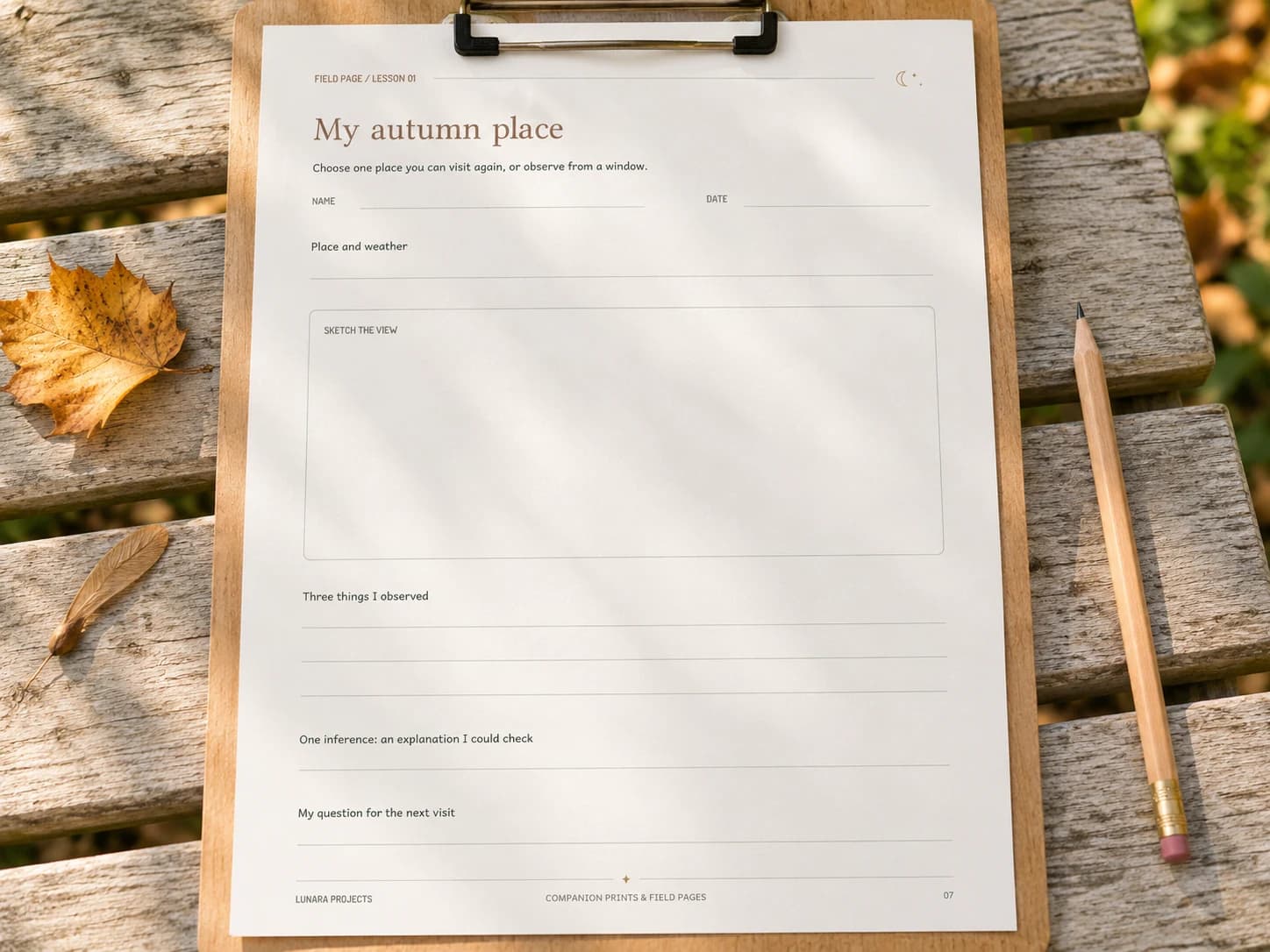 The blank My autumn place observation page on a clipboard on a garden bench, with a pencil, fallen leaf, and maple seed nearby.