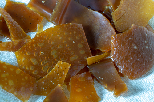 Amber-colored pieces of dried portable soup in a modern historical reconstruction.